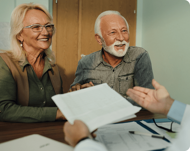 Elderly pair consulting with advisor